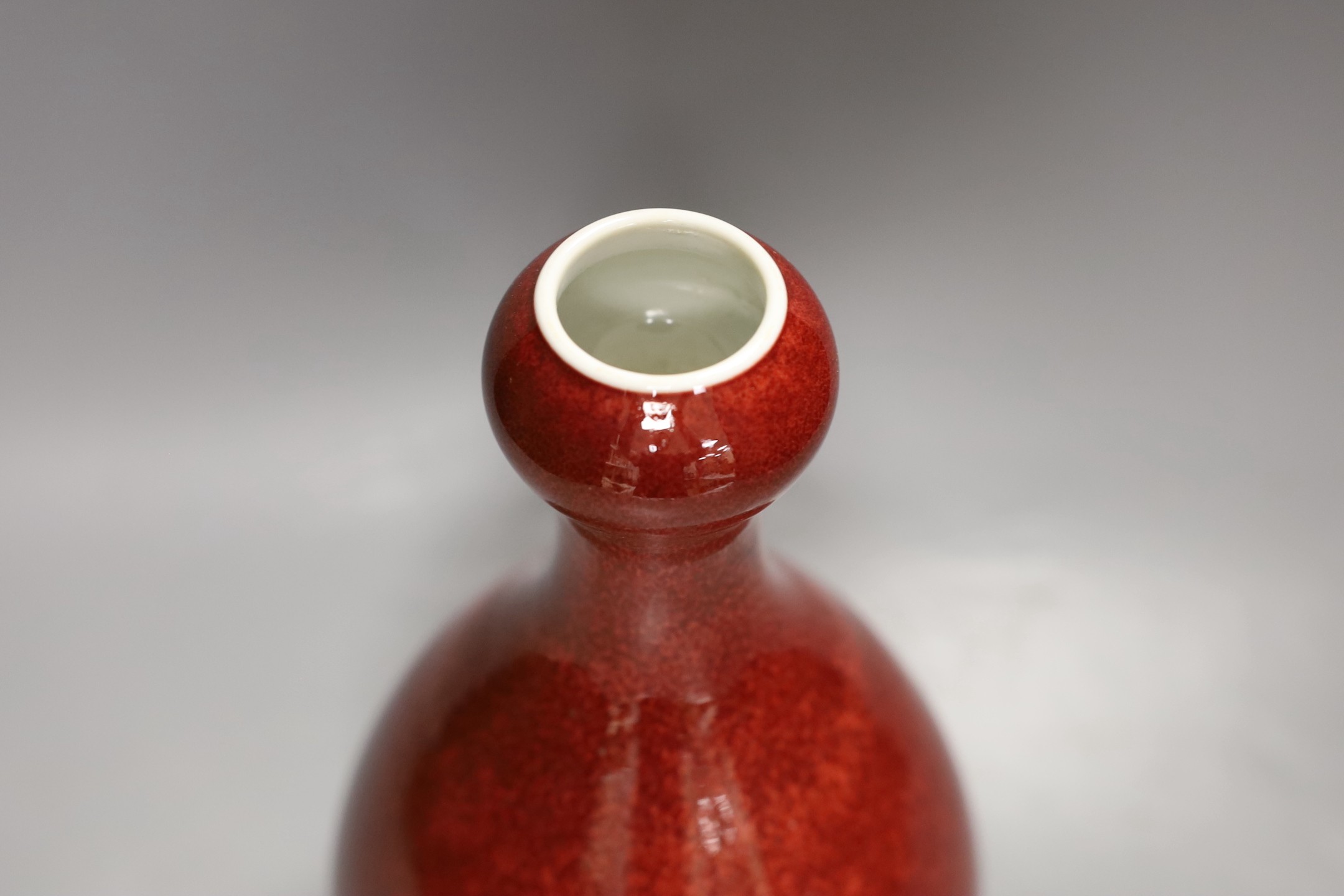 A Chinese sang de boeuf glazed vase 26 cms high.